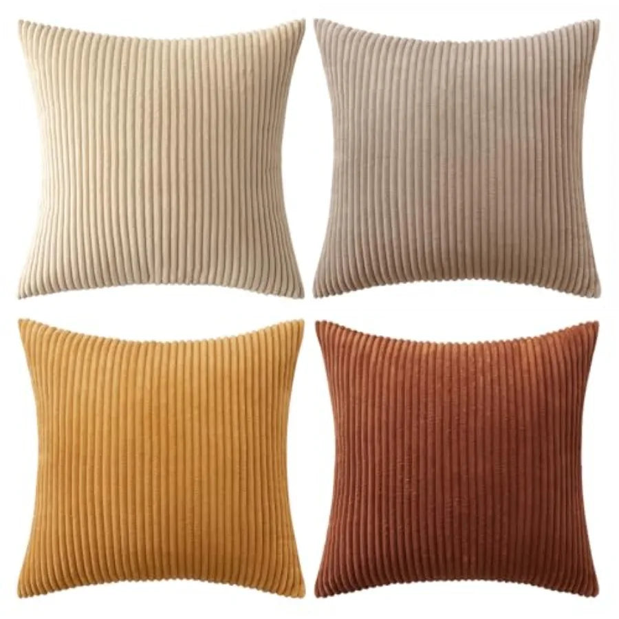 Four square ribbed throw pillows arranged in a 2x2 grid on a white background, shown in beige, taupe, mustard yellow, and rust orange.