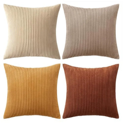 Four square ribbed throw pillows arranged in a 2x2 grid on a white background, shown in beige, taupe, mustard yellow, and rust orange.