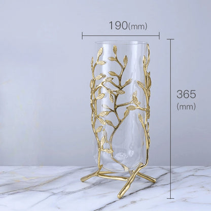 Elegant Clear Glass Vase with Gold Metal Branches featuring a three-legged base, ensuring security and style.