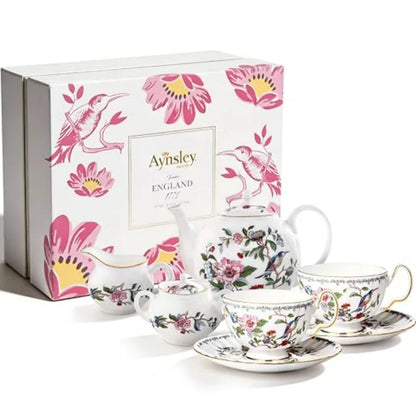 Exquisite Aynsley 7-Piece Tea Set positioned on a dining table, exuding luxury and charm.