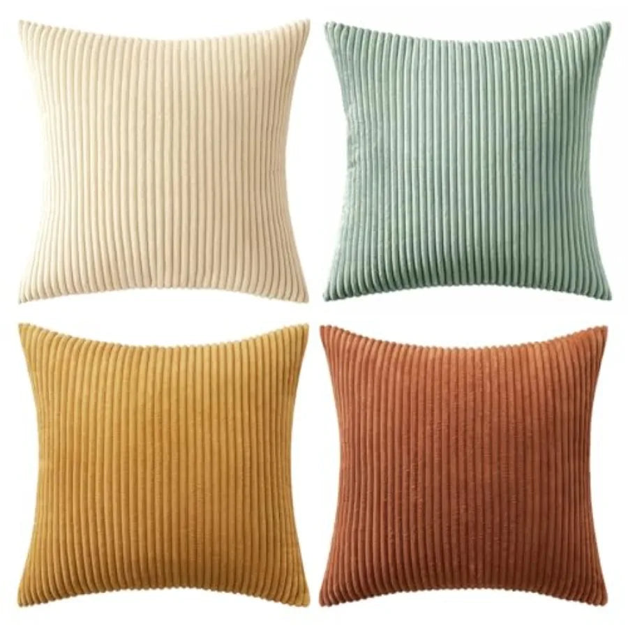 Four ribbed texture throw pillows in beige, green, yellow, and brown on a white background.