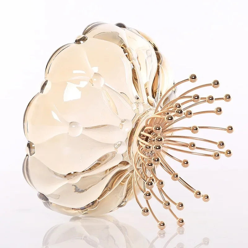 Stylish Amber Glass Flower Bowl with Beaded Metal Base - Close-up of the amber glass bowl reflecting light, demonstrating its premium quality.
