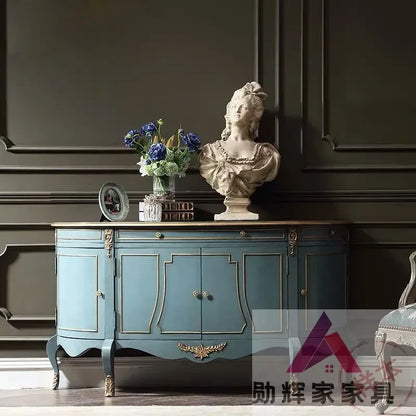 Elegant Blue & Gold French-American Style Sideboard Cabinet in a dining room setting; an elegant blue and gold sideboard that adds sophistication to any gathering.