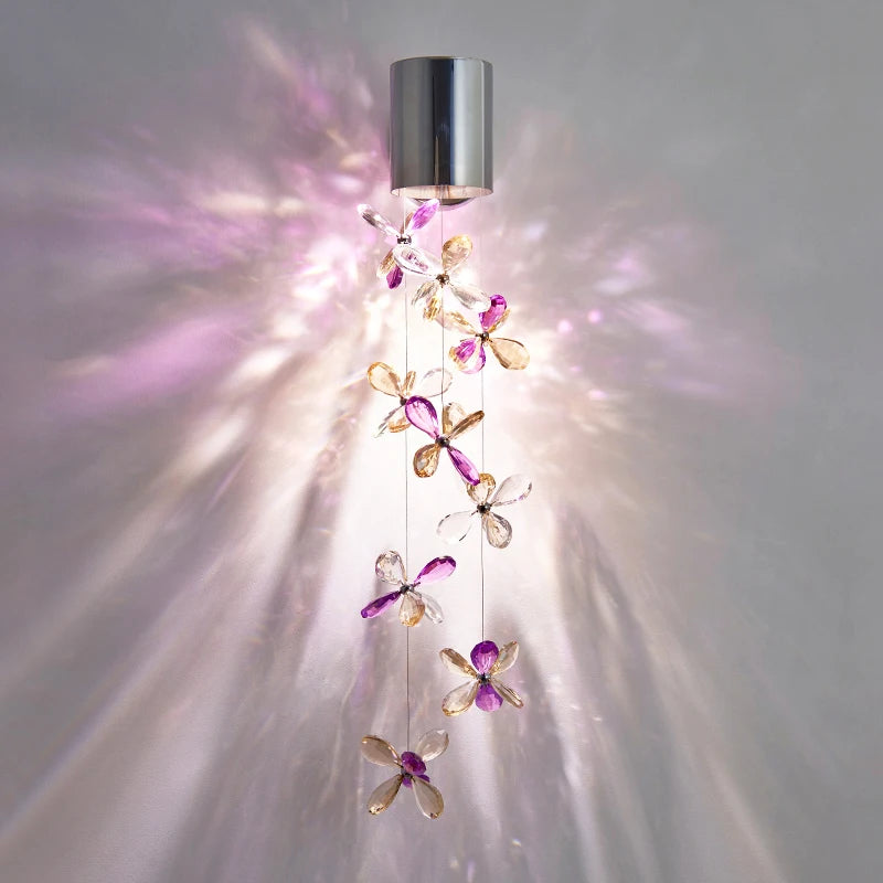 Exquisite Modern Crystal Wall Lamp emitting vibrant blue light, perfect for lively gatherings.