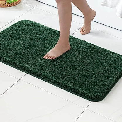 Side-by-side comparison of the 2-Piece Dark Green Microfiber Bath Rug Set showcasing different sizes.