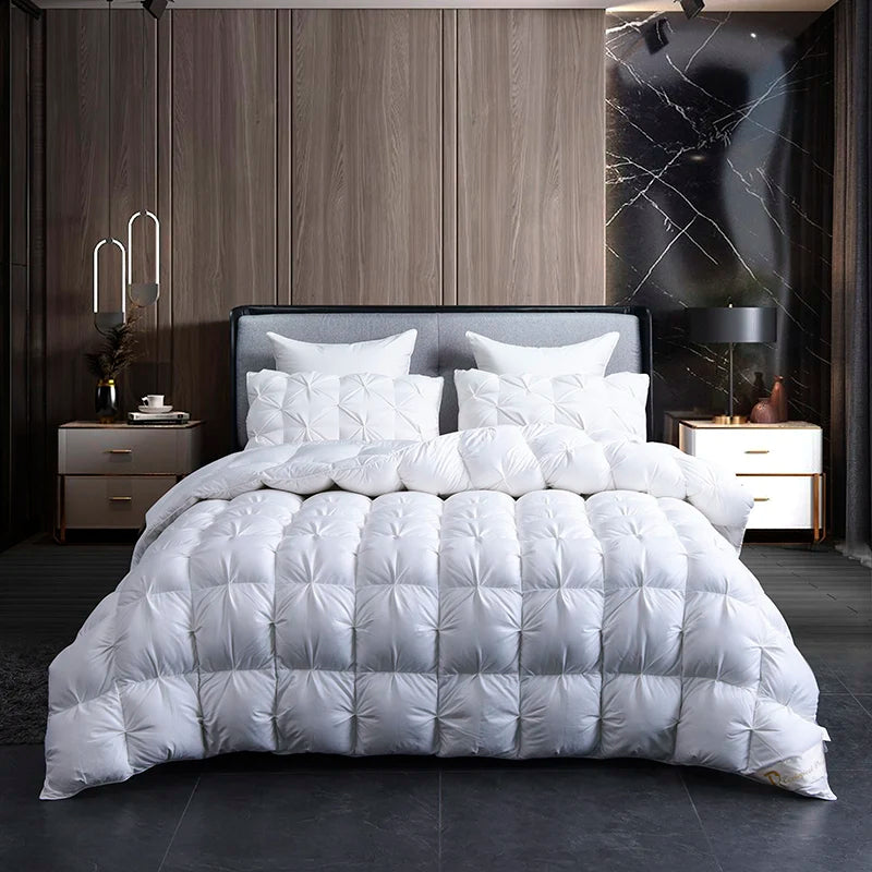 Luxurious White Goose Down Comforter surrounded by fluffy pillows, creating a comfortable sleep environment.