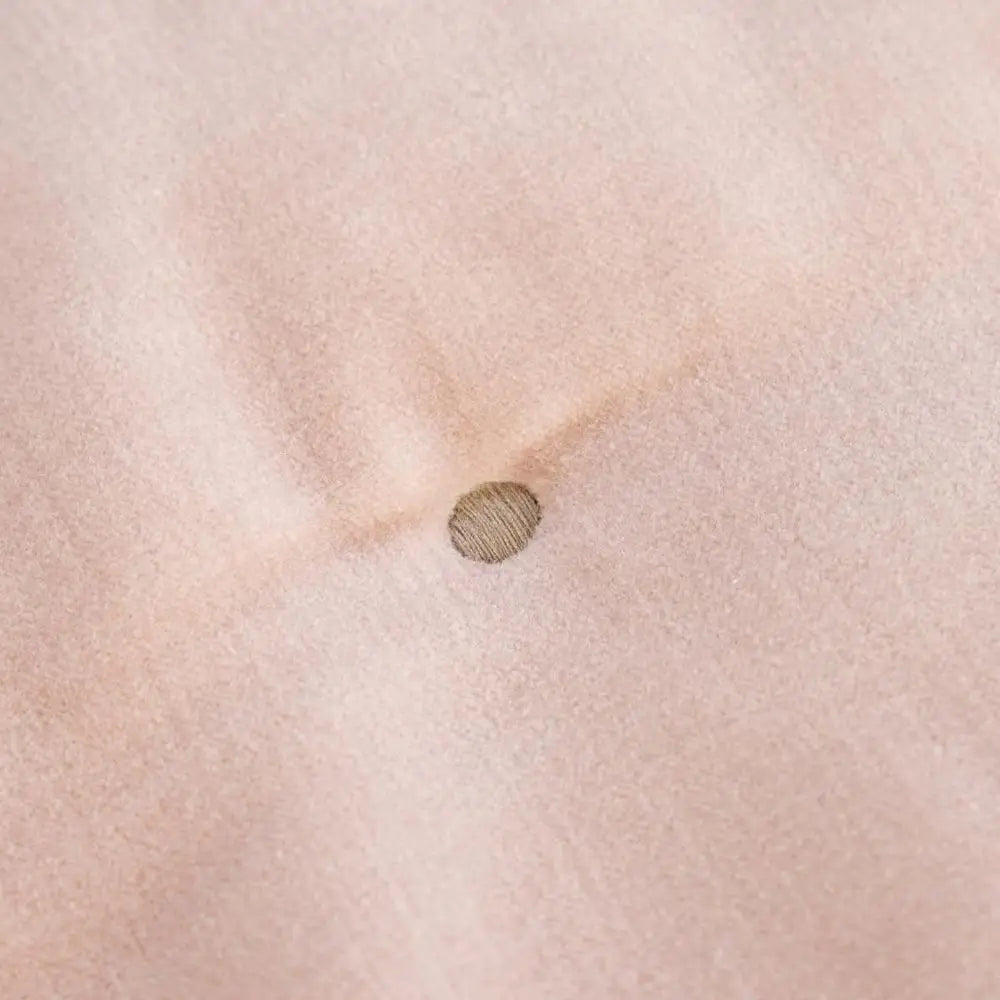 Reversible Luxury Cotton Velvet Throw styled on a sofa, featuring the dusky pink color and demonstrating its use as a cozy reversible cotton velvet throw.