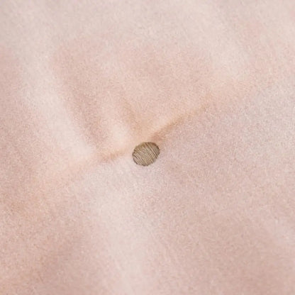Reversible Luxury Cotton Velvet Throw styled on a sofa, featuring the dusky pink color and demonstrating its use as a cozy reversible cotton velvet throw.