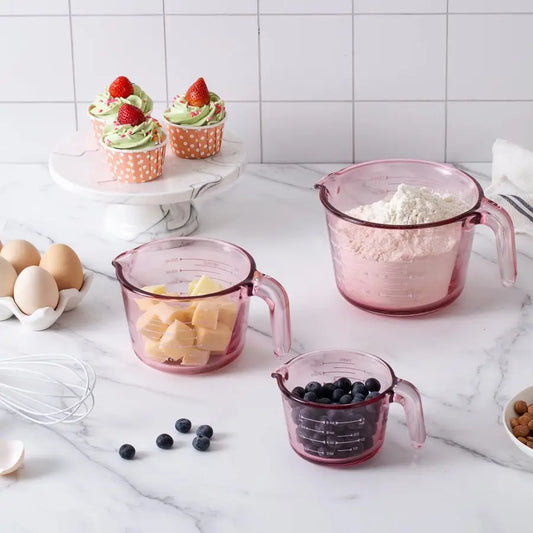 3-Piece Durable Glass Measuring Cup Set showcasing vibrant purple and pink colored glasses, perfect for measuring liquids accurately.
