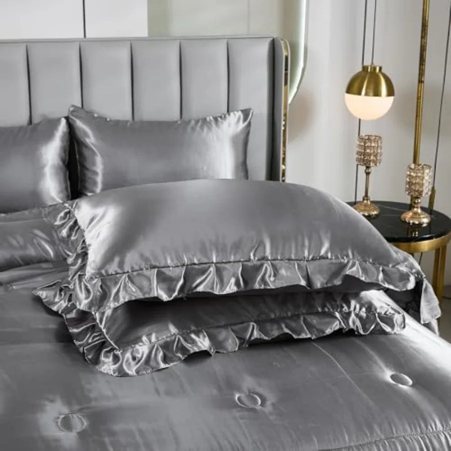 Flat lay of the Grey Satin Comforter Set including fitted and flat sheets plus 4 pillowcases, all showcasing a chic bedding ensemble.