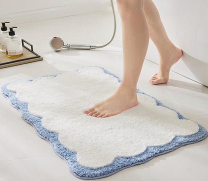 20 x 30 Cotton Bath Rug, Scalloped Edge Bathroom Mat displayed alongside decorative towels for a fresh look