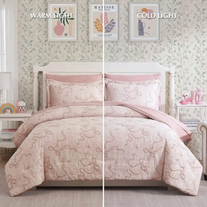 Luxury Blush Pink Bowknot Comforter Set alongside matching pillows, a charming blush pink comforter set for an elegant bedroom.