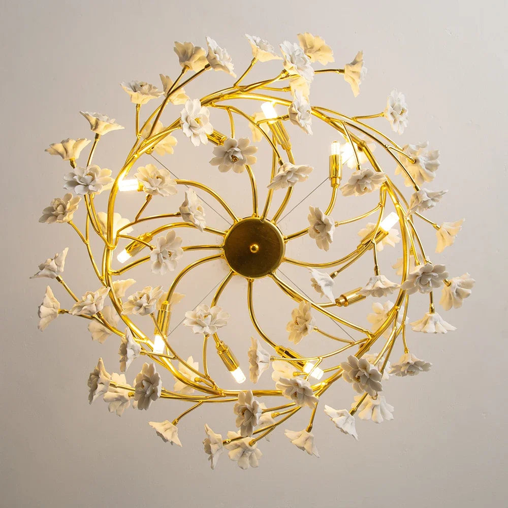 Elegant Gold Luxury Crystal Chandelier creating a warm glow in an entryway, exemplifying the beauty of a luxurious gold crystal chandelier.