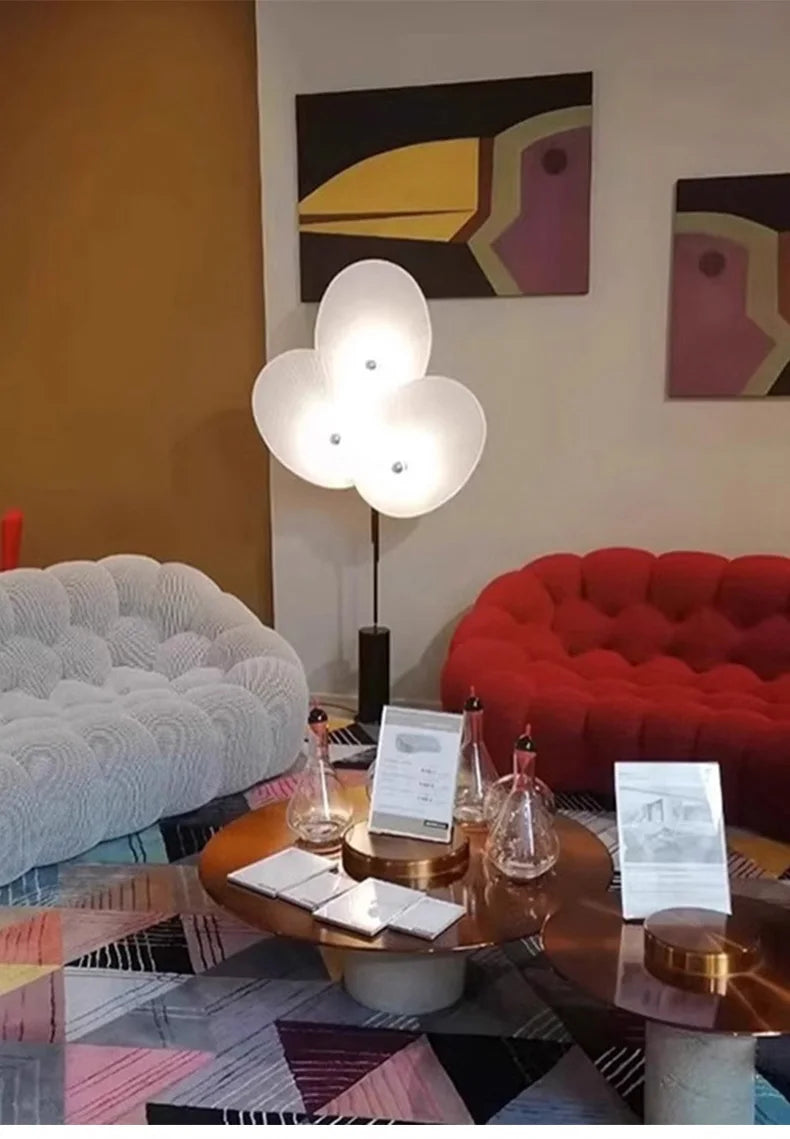 Elegant Modern Triple Floral Floor Lamp creating an inviting atmosphere in a living space.