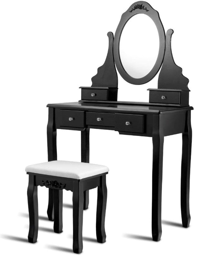 Black Vanity Table Set with a rotating mirror, enhancing the look and functionality of modern makeup vanity.