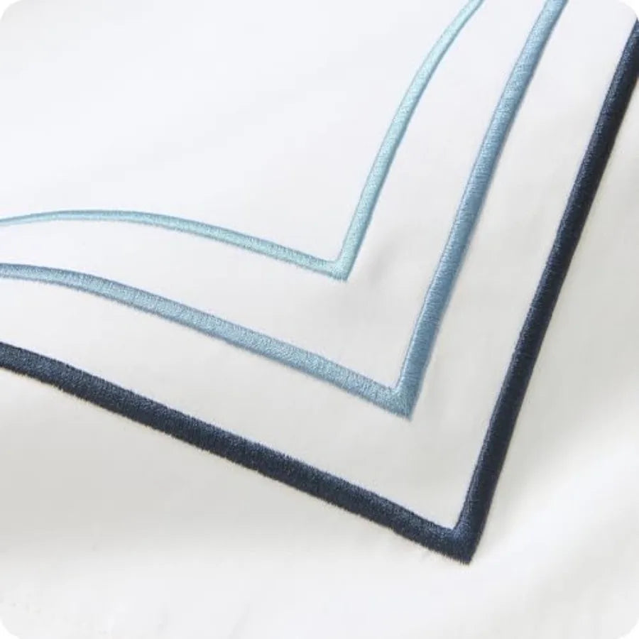 Luxury Egyptian Cotton Duvet Cover Set styled with neutral-toned sheets and plush pillows, creating a hotel-inspired cozy atmosphere.