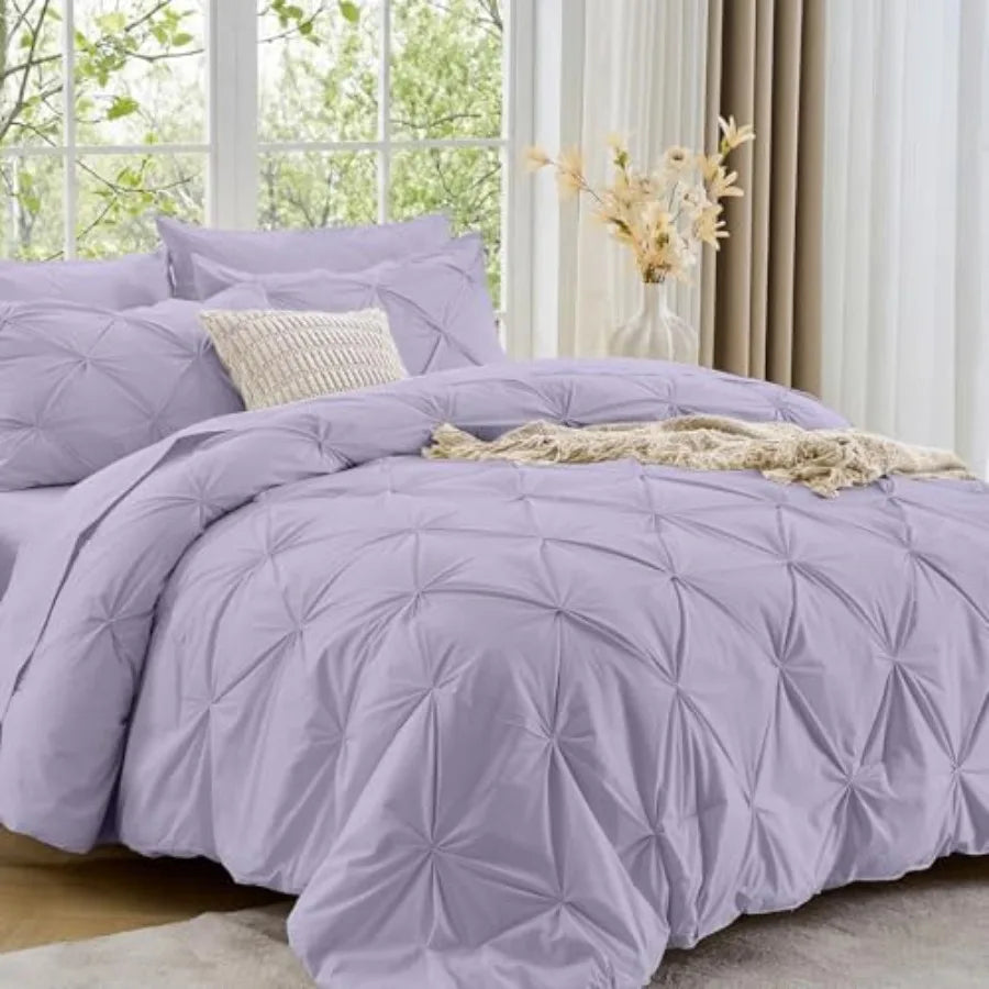 Our Queen 7-Piece Pintuck Comforter Set is designed for those who appreciate the finer things, offering a structured texture and lavish softness.