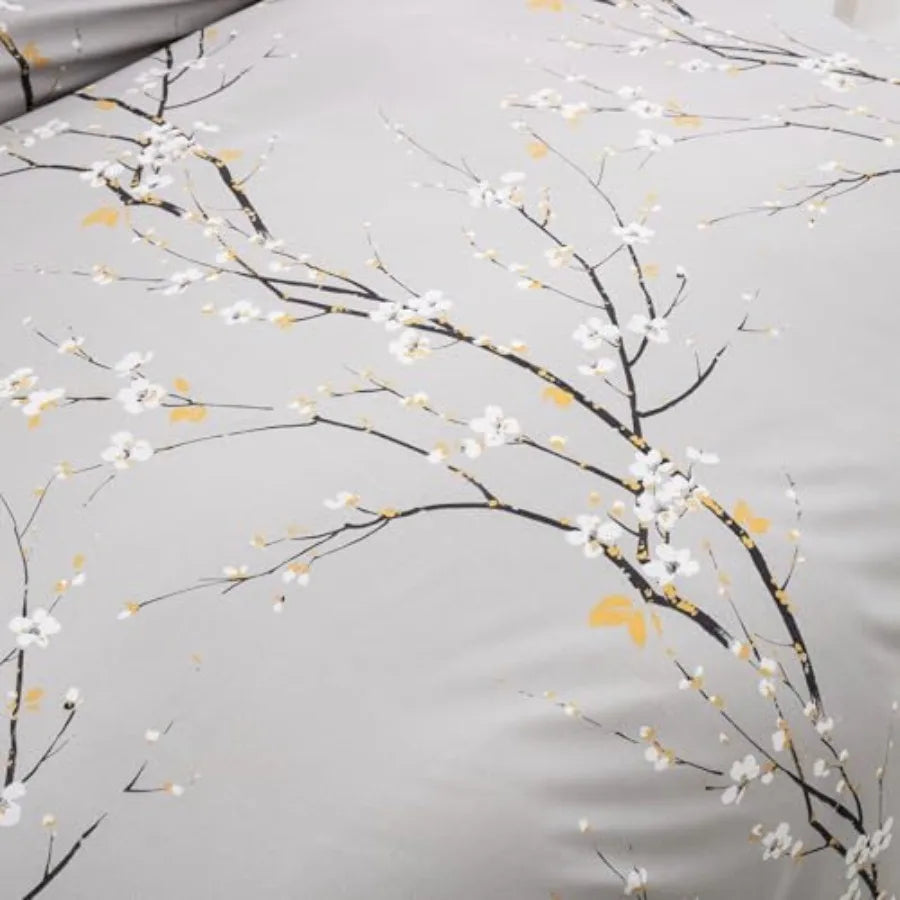 Close-up image of the ornamental details in the Sage Green & Yellow Floral Duvet Cover Set Queen, emphasizing the vibrant floral prints perfect for modern decor.
