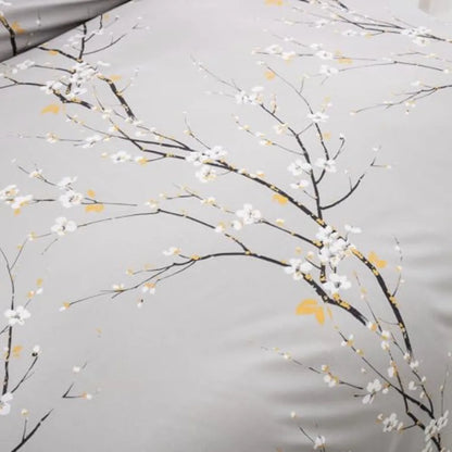 Close-up image of the ornamental details in the Sage Green & Yellow Floral Duvet Cover Set Queen, emphasizing the vibrant floral prints perfect for modern decor.