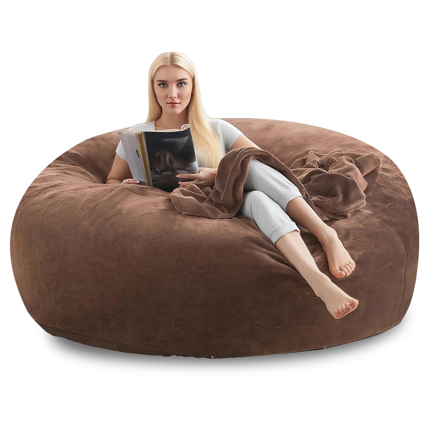 A cozy setup featuring the Oversized Faux Fur Bean Bag Chair alongside a throw blanket and a few books, perfect for creating a relaxing space with this oversized bean bag chair.