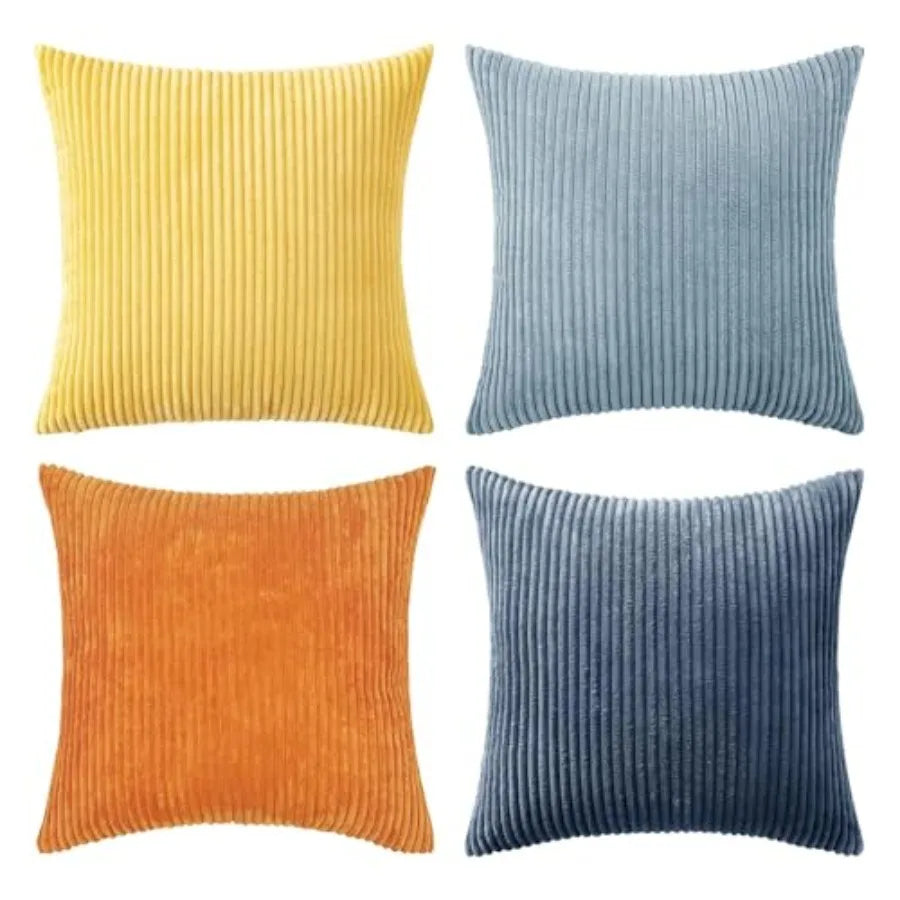 Four ribbed texture throw pillows in yellow, blue, orange, and navy on a white background.