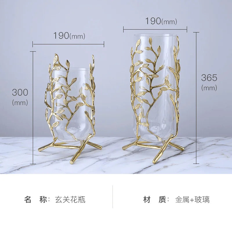 Elegant Clear Glass Vase with Gold Metal Branches on a table, combining minimalist design and artistic flair.