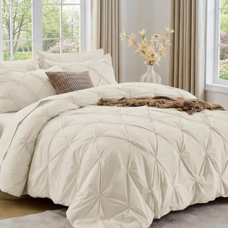Experience cloud-like comfort with our Queen comforter set, designed with soft microfiber fabric and a stylish pintuck finish for a cozy bedroom upgrade.