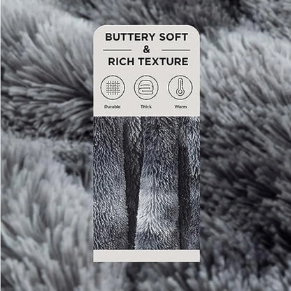 The 50x60 Grey Faux Fur Sherpa Throw Blanket, Plush Reversible draped elegantly over a stylish chair.