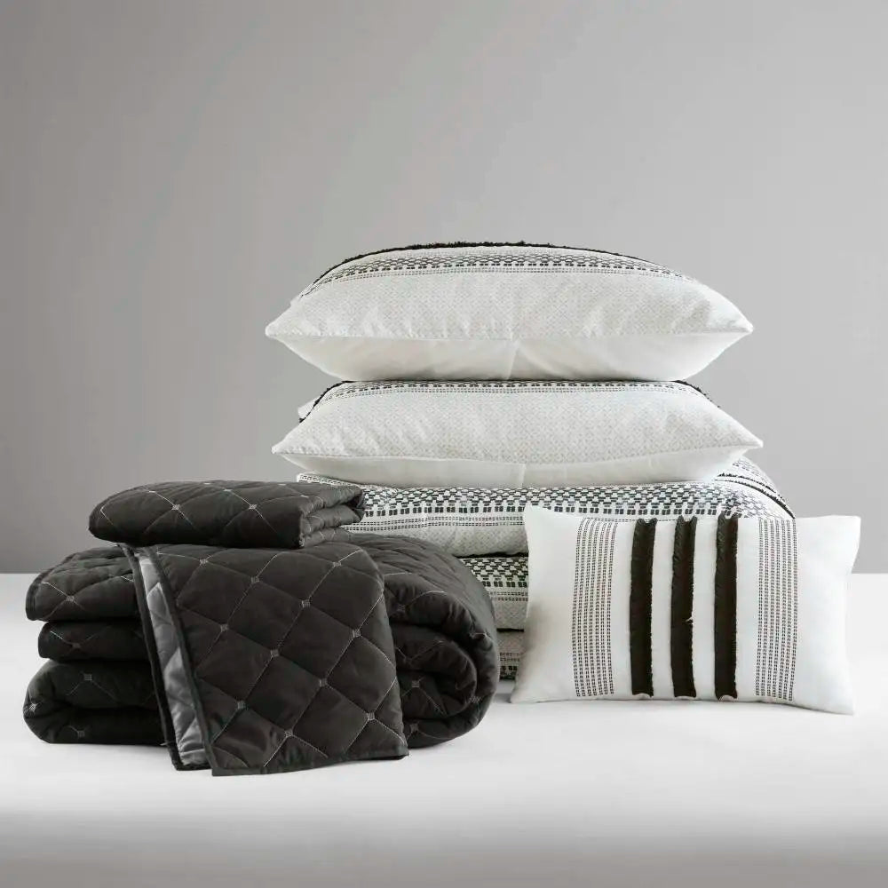 Elegant 7-piece king size comforter set in black & white stripes, perfect for a serene and inviting bedroom atmosphere.