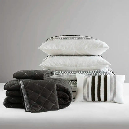 Elegant 7-piece king size comforter set in black & white stripes, perfect for a serene and inviting bedroom atmosphere.