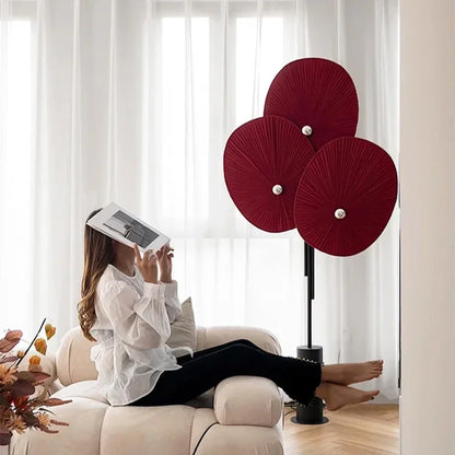 Elegant Modern Triple Floral Floor Lamp illuminating a stylish bedroom interior.