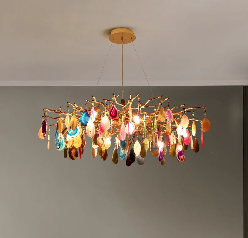 Art deco chandelier hanging elegantly, displaying a mix of bright colors and a captivating design.