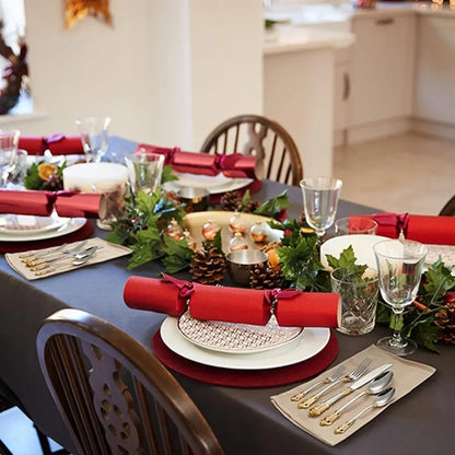 Artistic arrangement of the Everly Quinn Luxury Gold Accent Flatware Set on a white marble dinnerware backdrop, highlighting the luxury flatware set's designer appeal.