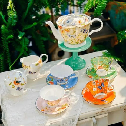 Aynsley Fine Bone China Tea Set 7-Piece featuring luxurious floral teapot and cups against a charming background.