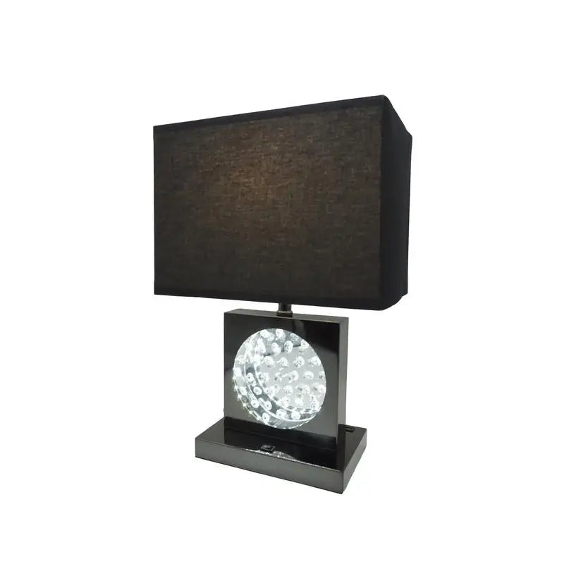 Close-up of the Elegant 22" Modern Crystal Accent Table Lamp highlighting the shimmering crystals and the black fabric shade of this elegant table lamp.