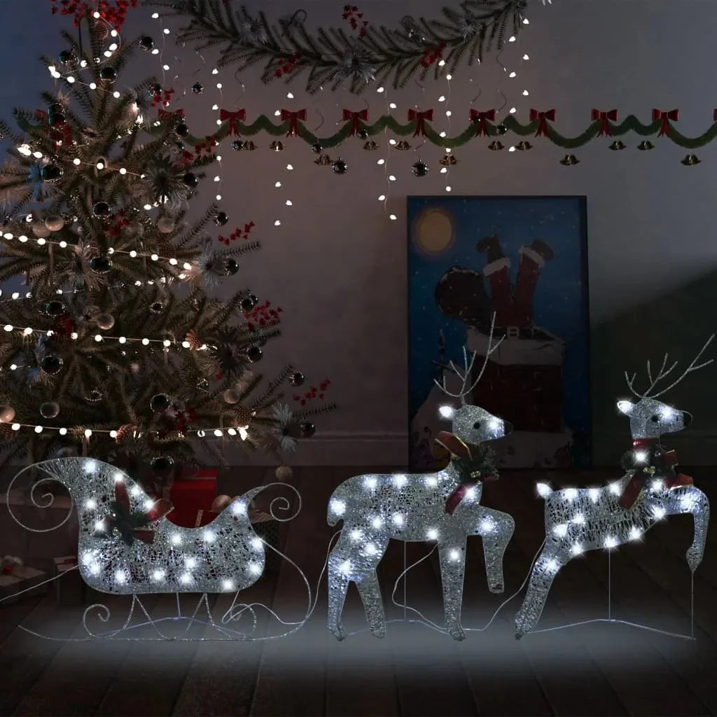 The Outdoor Silver Reindeer & Sleigh Christmas Decoration w/60 LED Lights glowing at night, showcasing the stunning silver reindeer decoration that adds charm to holiday celebrations.