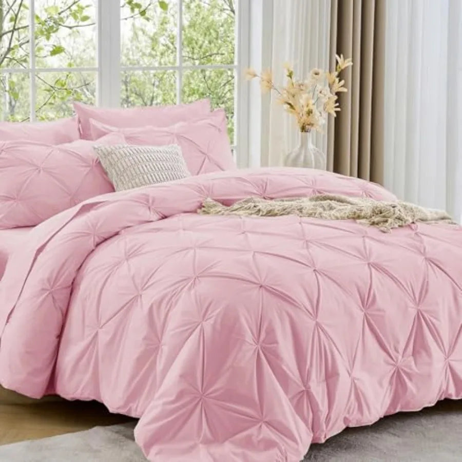 Relax in style with the Queen comforter set, featuring a chic pinch pleat design that effortlessly blends luxury and comfort for a hotel-like experience.