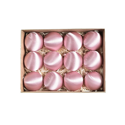 Collection of satin silk ball ornaments featured in a holiday setting, adding a touch of elegance and joy to Christmas decor.