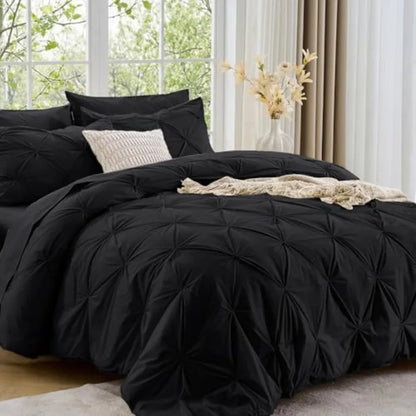 Experience the perfect balance of luxury and comfort with the Queen 7-Piece Pintuck Comforter Set, an essential for any stylish space.