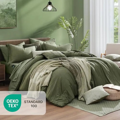 Details of the reversible olive green comforter and shams from the olive green 7 piece bed in a bag set on a stylish bed.