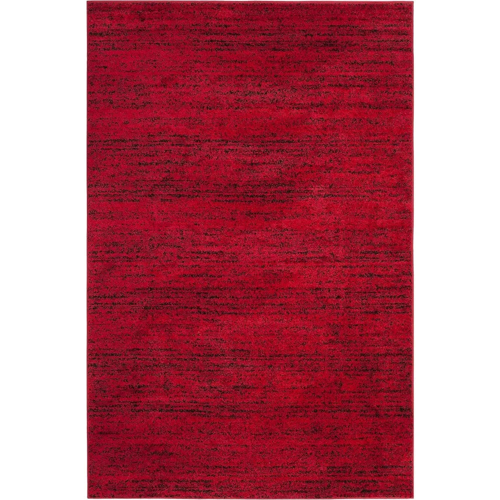 Stylish living room featuring the Modern Black & Red 6' x 9' Loomed Area Rug as a focal point, demonstrating its versatility as a black and red rug.
