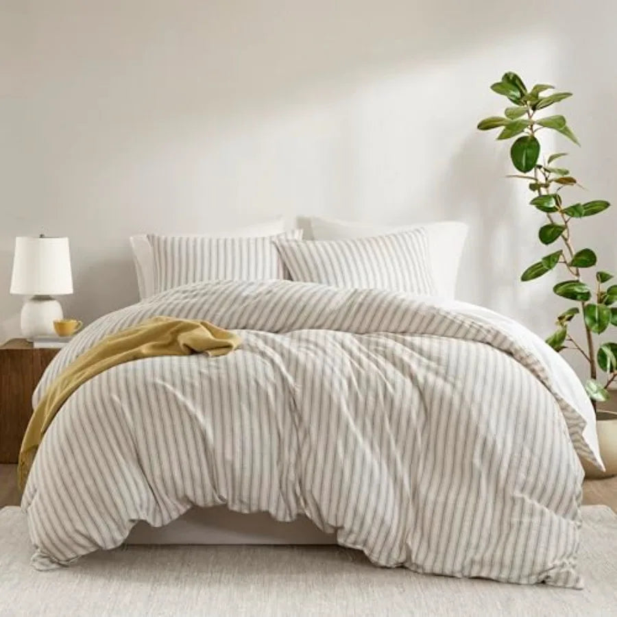 Stylish presentation of a Luxury Linen Blend Striped Duvet Cover Set on a neatly made bed, illustrating its soft neutral tones and high-end bedding appeal.
