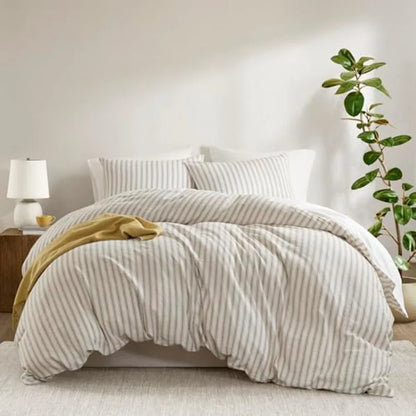 Stylish presentation of a Luxury Linen Blend Striped Duvet Cover Set on a neatly made bed, illustrating its soft neutral tones and high-end bedding appeal.