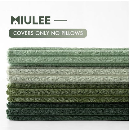 A stack of MILEE microfiber towels in various shades of green, displayed on a clean white background with a text overlay that reads 'MILEE — COVERS ONLY NO PILLOWS'.