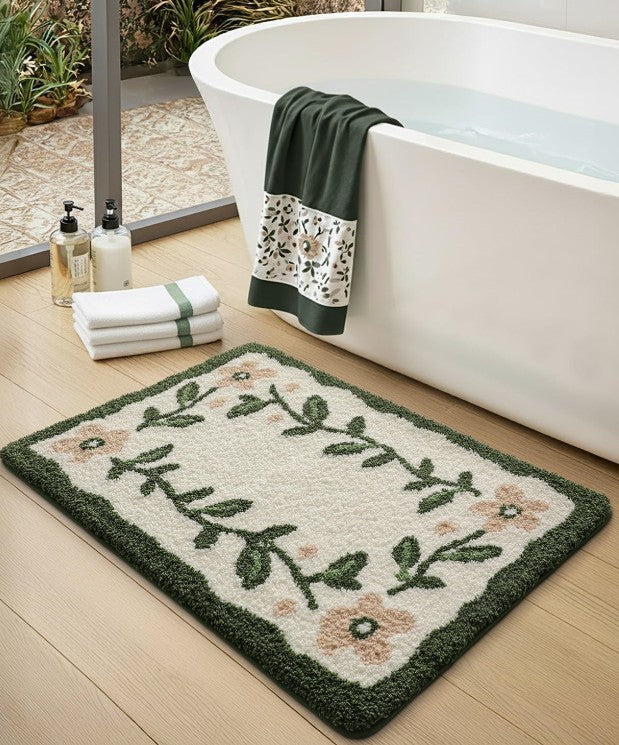 32x20 Microfiber Floral Bath Mat in a sunny bathroom setting, featuring vibrant pink flowers and fresh green accents.