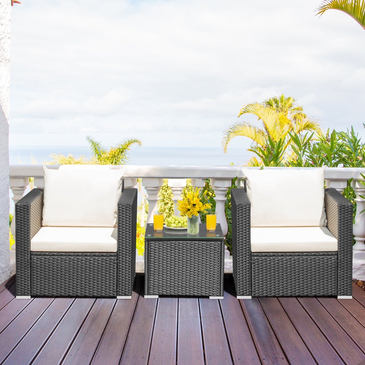 2 single sofas and glass table from the 3-Piece Outdoor Wicker Patio Conversation Set – cozy outdoor wicker conversation set for outdoor gatherings.
