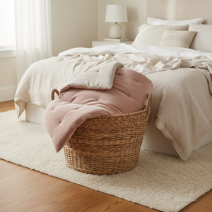 Reversible Luxury Cotton Velvet Throw with cozy bedding, highlighting its luxurious softness and the stylish dusky pink color of this reversible cotton velvet throw.