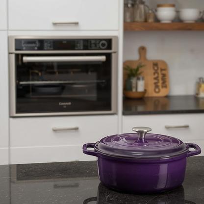 Purple cast iron dutch oven 6QT with herbs beside it, emphasizing its stylish presence in any kitchen layout.