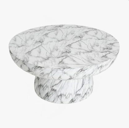 Durable and lightweight materials of the Patsy Luxe Faux Marble Pedestal Coffee Table, highlighting its all-weather suitability as a modern faux marble table.