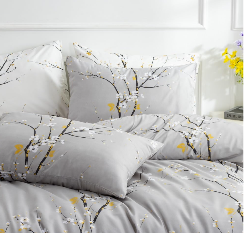 Sage green floral duvet cover showcasing hidden zipper closure and corner ties for secure fit.